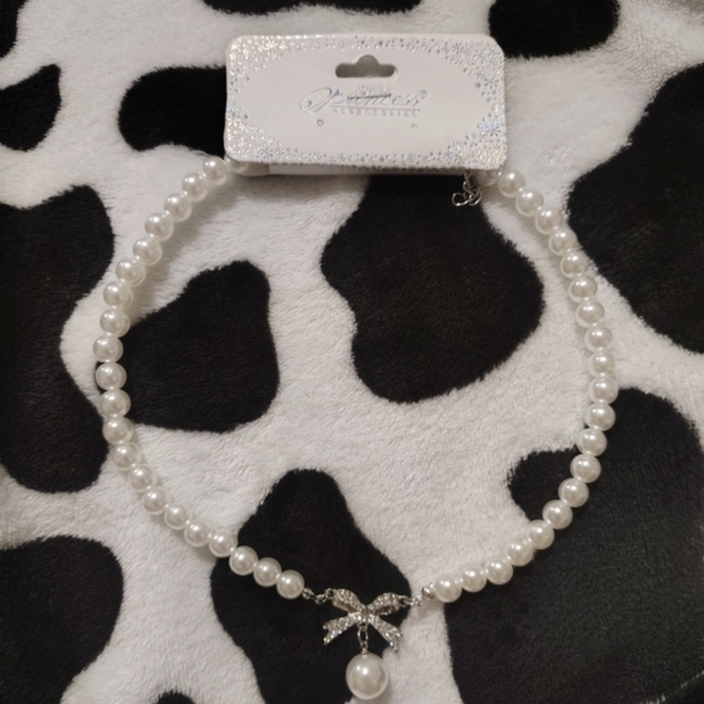 Elegant Pearl Necklace with Bow Charm